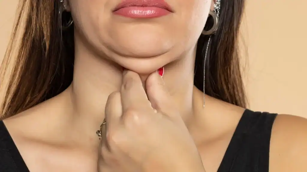 An image of a woman with double chin, sad, worried : Non Surgical Double Chin Removal Treatment in Dumbarton, UK